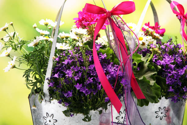 mothers day flower in silver bag on wooden table