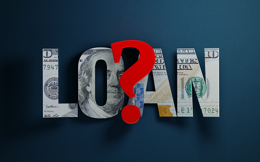 Loan text textured with one hundred American dollar banknote and a red question mark on blue background. Horizontal composition with copy space. Great use for loan and mortgage related concepts.