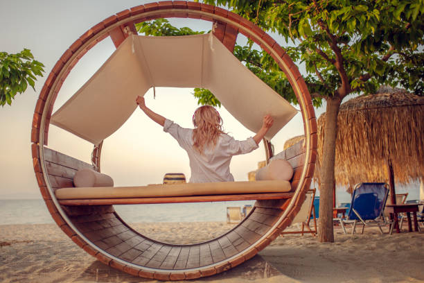 istock Young caucasian woman enjoying at the beach 958346018