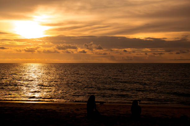 istock Beach sunset. Beach at sunset with ocean waves and dramatic high contrast filter. Taken at Thailand empty golden beach. 958346318
