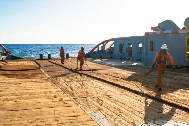 istock AHTS vessel doing static tow tanker lifting. Ocean tug job 958346394