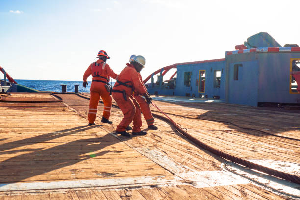 istock AHTS vessel doing static tow tanker lifting. Ocean tug job 958346484
