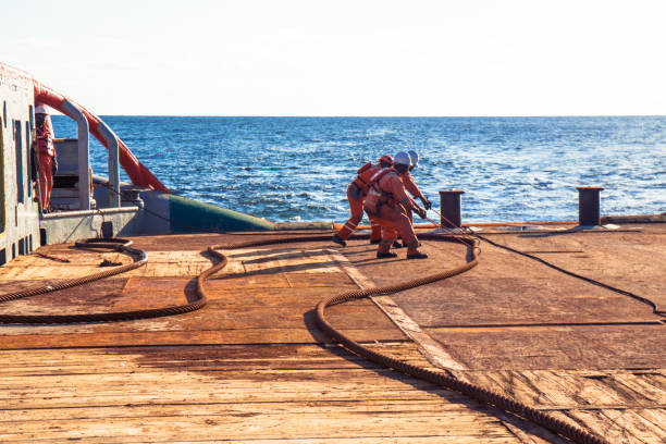 istock AHTS vessel doing static tow tanker lifting. Ocean tug job 958346550