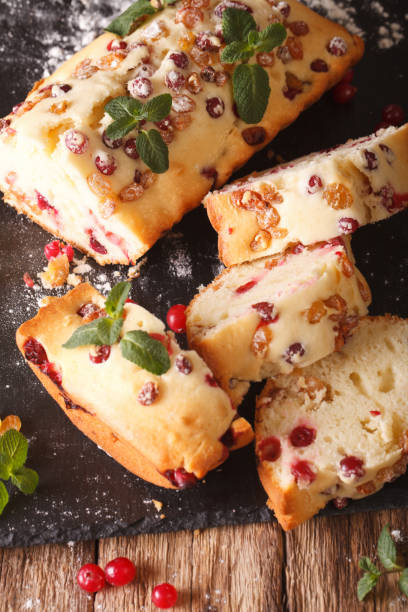 istock Traditional fruit cake with cranberries and raisins close-up. vertical 958350264