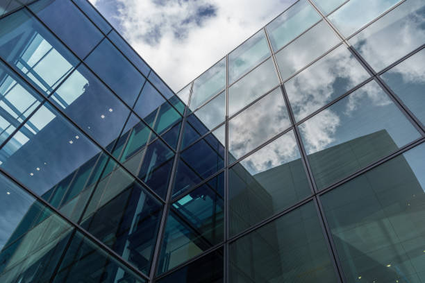 istock The glass architecture in city against a sky 958359500