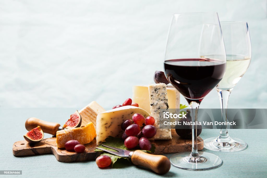 Variety of cheeses on serving board Cheese board: variety of cheeses on marble serving board Wine Stock Photo