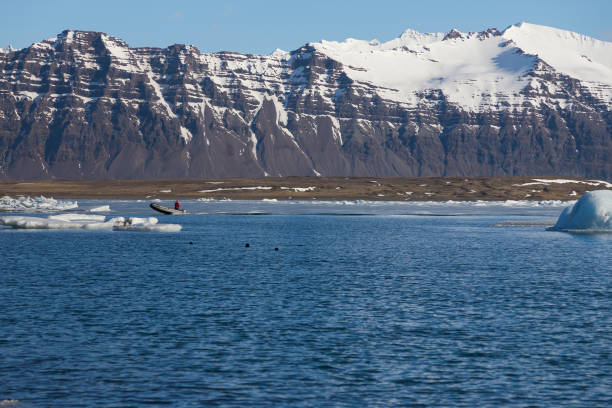 istock Black volcano mountain over Jokulsarlon glacier 958375414