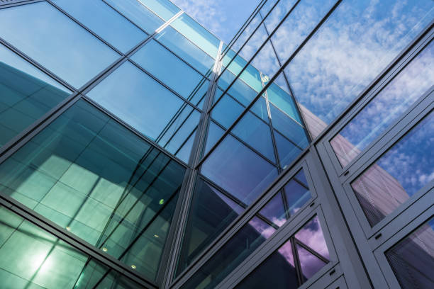 istock The glass architecture in city against a sky 958375464