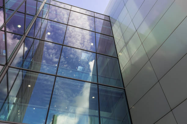 The glass architecture in city against a sky