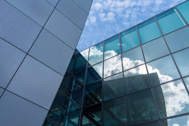istock The glass architecture in city against a sky 958375778