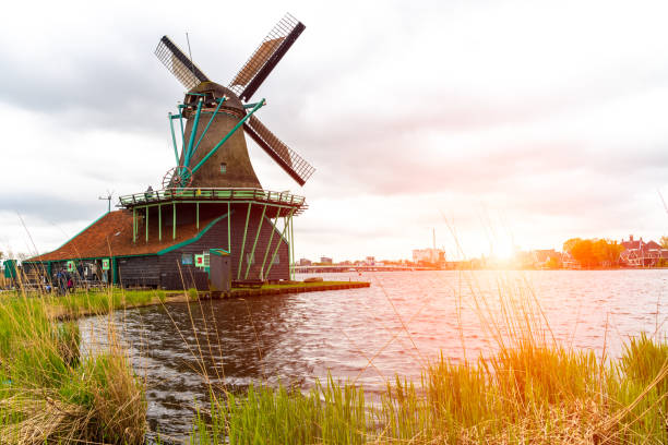istock Sunset above old historical windmills 958378170