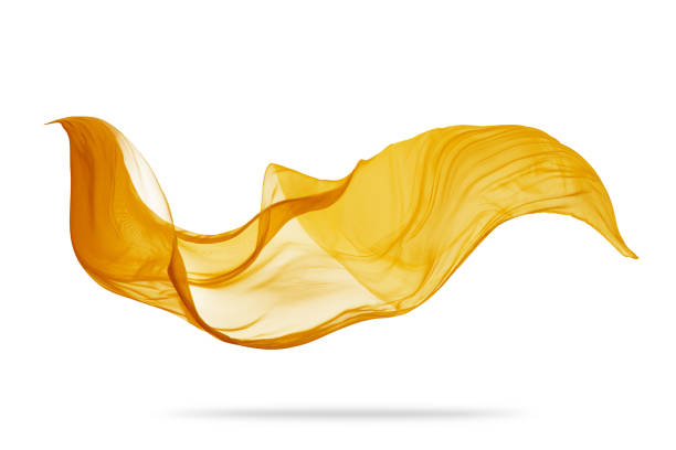 Piece of flying golden cloth on white background Piece of flying golden cloth isolated on white background. High resolution image scarf stock pictures, royalty-free photos & images
