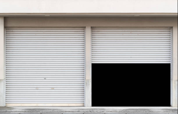 Garage with two entrances and open shutter Garage with two entrances and open shutter shutter door stock pictures, royalty-free photos & images