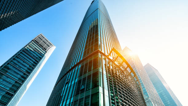 istock Up View in Financial District under Sun Flare, Shanghai, China 958385270