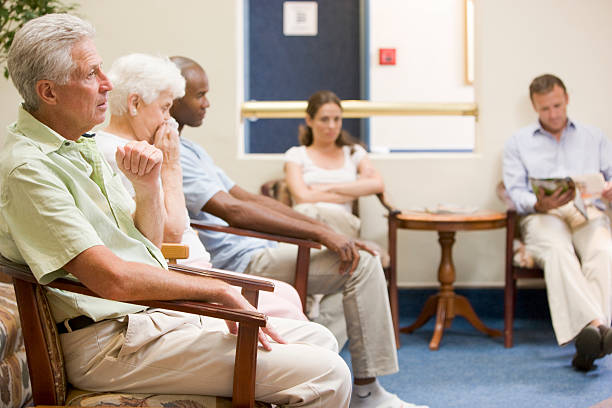 Five people in waiting room  waiting room stock pictures, royalty-free photos & images