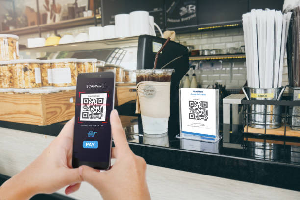 istock Qr code payment, E wallet , cashless technology concept. Man scanning  tag in Coffee shop accepted generate digital pay without money. 958387850