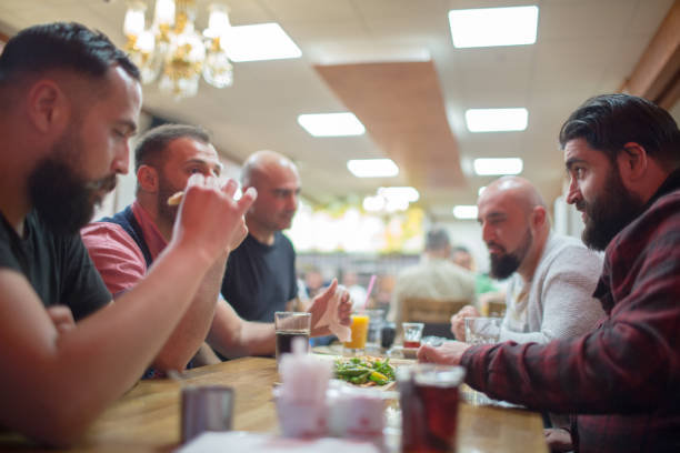 istock Arab people enjoying a traditional Iftar meal 958393312