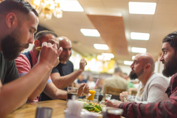 Arab people enjoying a traditional Iftar meal