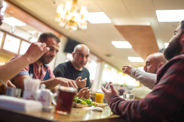 istock Arab people enjoying a traditional Iftar meal 958393340