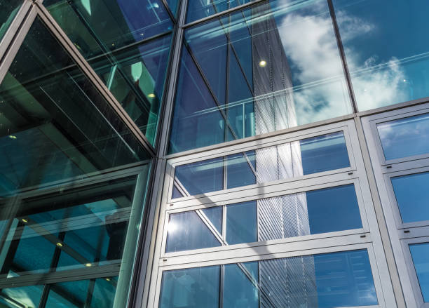 istock The glass architecture in city against a sky 958393344