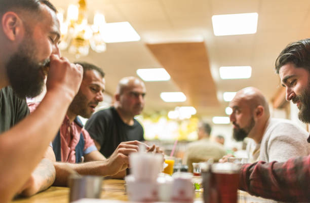 istock Arab people enjoying a traditional Iftar meal 958393368