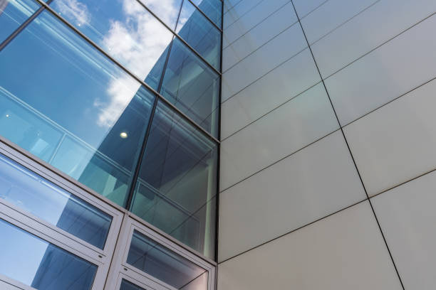 istock The glass architecture in city against a sky 958393428