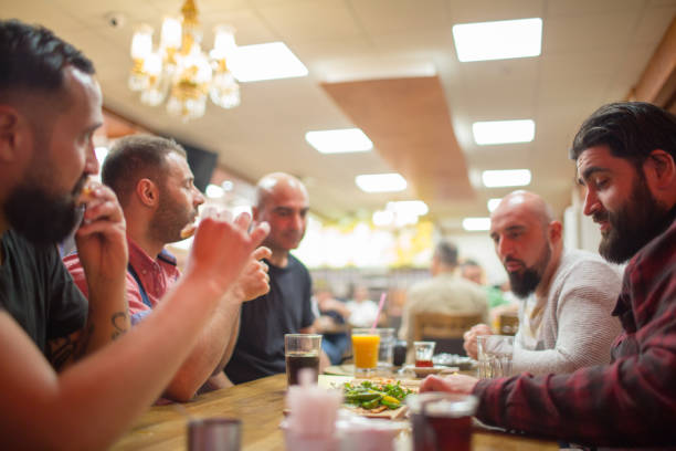 istock Arab people enjoying a traditional Iftar meal 958393450