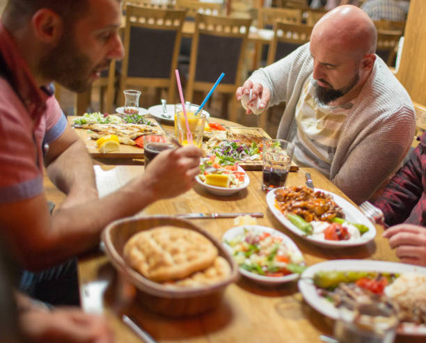 istock Arab people enjoying a traditional Iftar meal 958393992