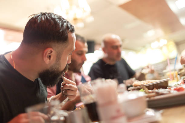 istock Arab people enjoying a traditional Iftar meal 958395672