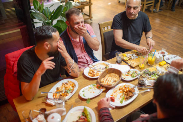 istock Muslim people eating traditional Iftar meal 958395786