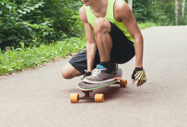 istock Man riding skateboard or longboard 958396194