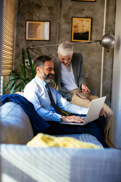 istock Old business couple working together 958403444