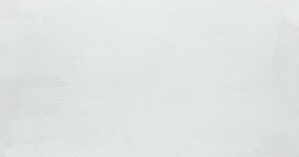 istock Grungy painted wall texture as background. Cracked concrete vintage floor texture, old white painted wall. Background washed painting. 958407840