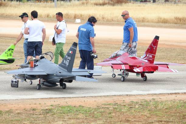 RC jet aircraft models Apulia: Enthusiasts of Alipuglia RC aircraft club take part in a local radio controlled turbine jet aircraft event in Oria, Apulia. hobbyist stock pictures, royalty-free photos & images