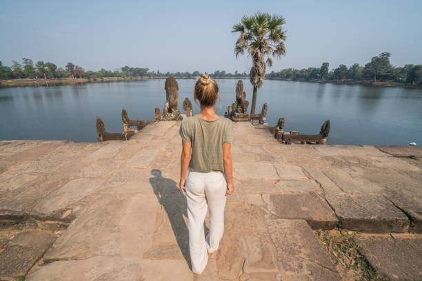 istock Asia adventure, female exploring ancient temples 958411258