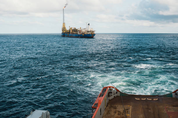 istock AHTS vessel doing static tow tanker lifting. Ocean tug job 958411612