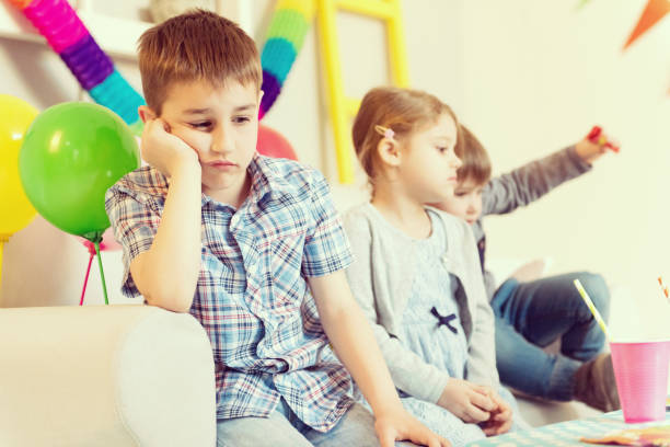 istock Sad boy at a birthday party 958415274