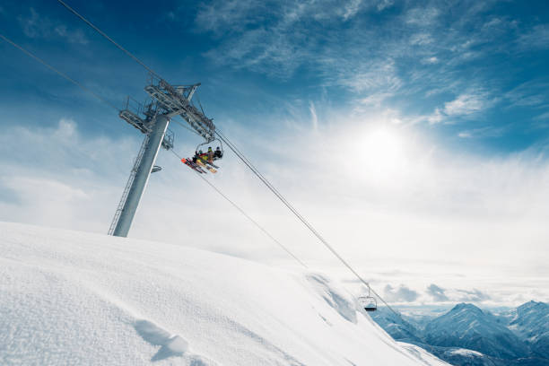 there are three man in the cabin of the cableway