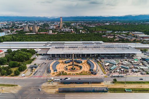Aerial front view of Sofia central train station and power plant in the background. The scene is situated in Sofia, Bulgaria (Eastern Europe). The footage is taken with DJI Phantom 4 Pro video drone.