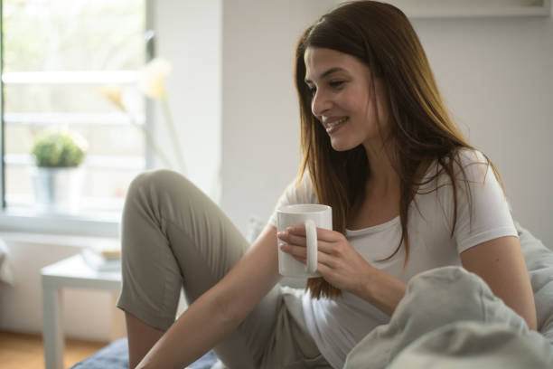 istock Young woman enjoying at home 958427756