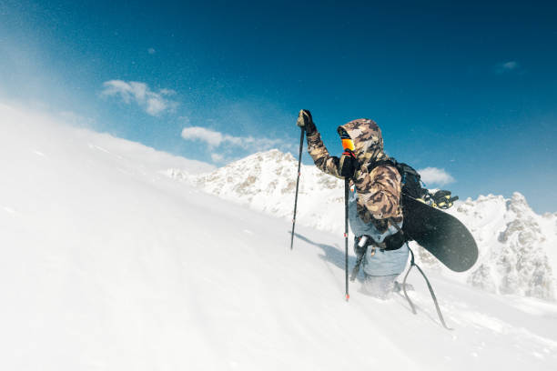 istock sportsman go with snowboard equipment 958427986