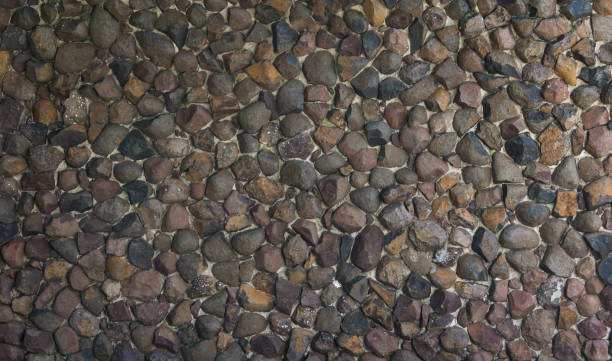 galets de pierre ronde planchers texture, fond de mur de roche, ton gris texture - stone rock garden white pebble photos et images de collection