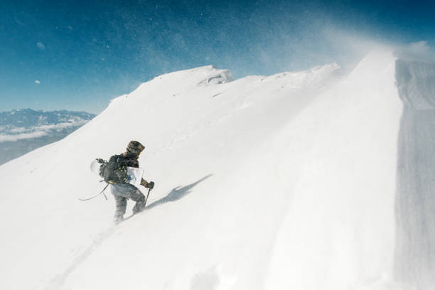 istock sportsman go with snowboard equipment 958429388