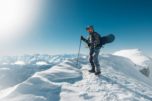 istock sportsman go with snowboard equipment 958429462