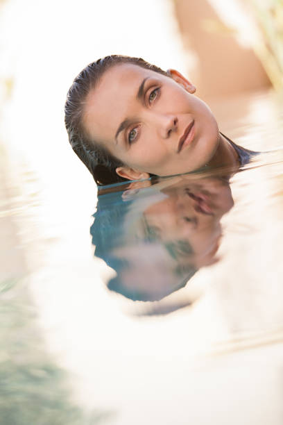 istock woman in a swimming pool 958429526