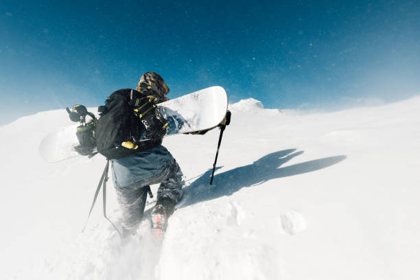 istock sportsman go with snowboard equipment 958429726