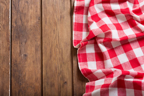 istock red checkered tablecloth on wooden table 958434674