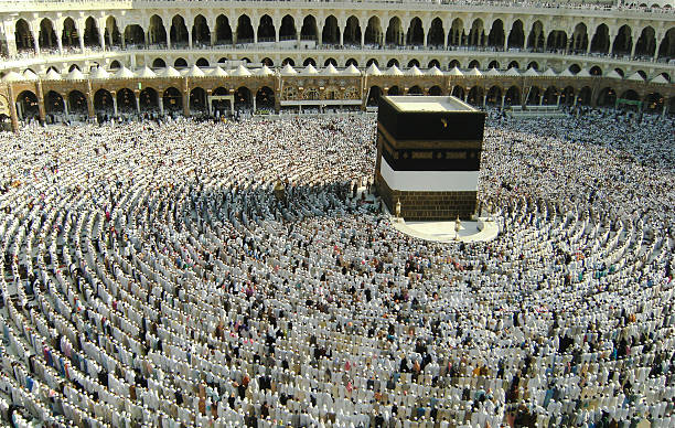 Large crowd assembles to pray at Haram Mosque, Saudi Arabia Muslims get ready to pray at Haram Mosque, Saudi Arabia facing the Kaaba during hajj season in late 2007. Non-muslims are not allowed to enter Haram Mosque or Mecca. muhammad prophet photos stock pictures, royalty-free photos & images