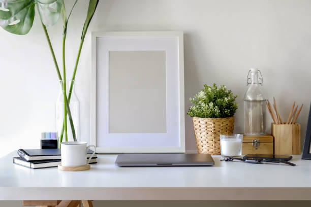 istock Workplace poster mockup.  Mock up poster and hipster accessory on white wooden ,workspace and copy space 958438258