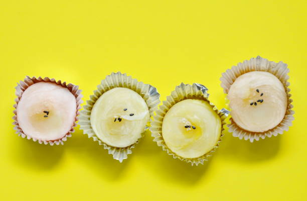 istock Chinese cake filled mashed sweet bean topping black and white sesame on yellow background 958442926